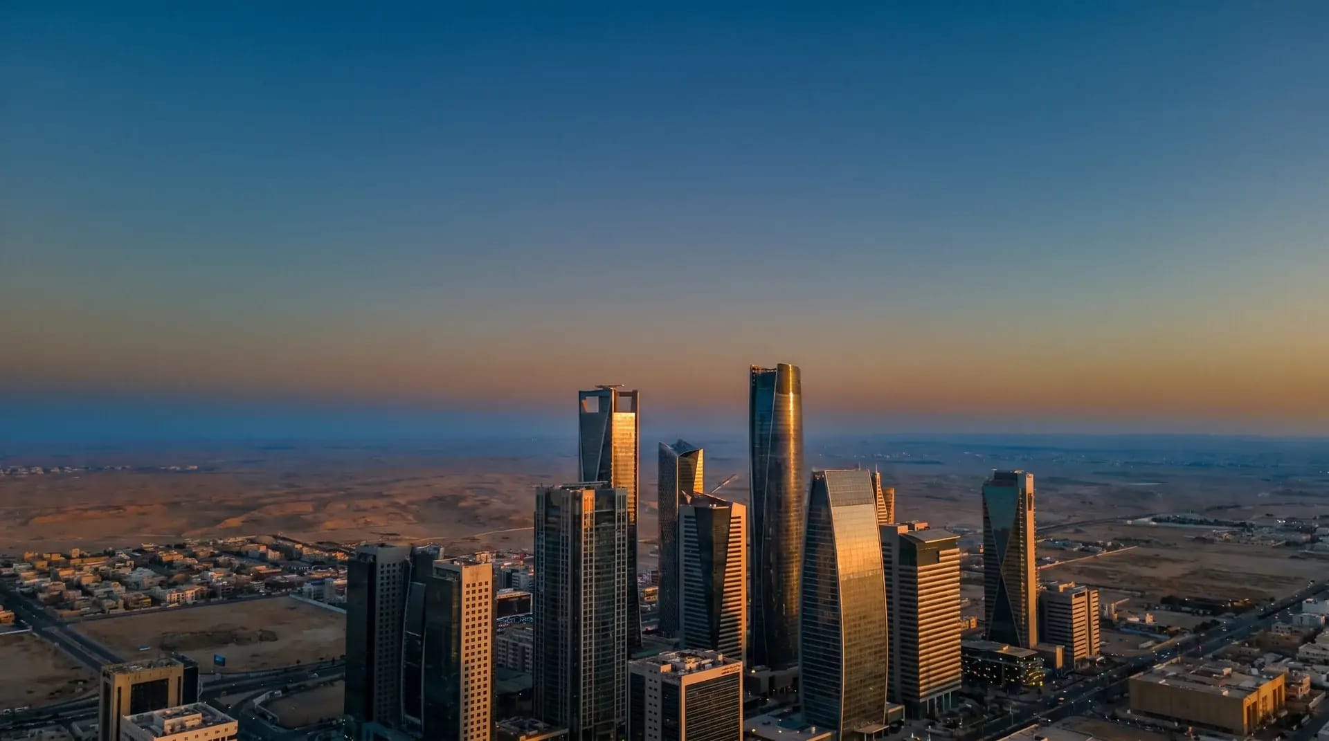 Riyadh's King Abdullah Financial District skyline at golden hour, representing Saudi Arabia's Vision 2030 workforce transformation